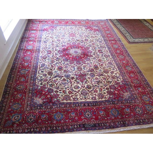 219 - A hand knotted woollen Meshed rug,  3.45m x 2.55m