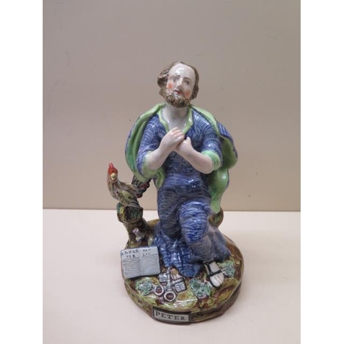 319 - A restored and damaged Staffordshire figure of St Peter, 22cm tall and Five 19th century blue and wh... 