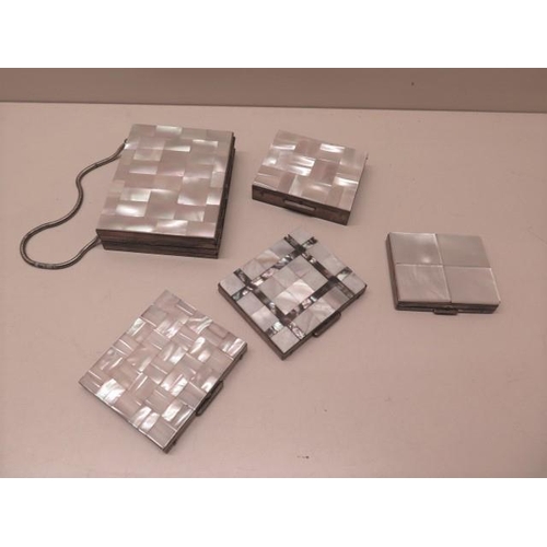 320 - Four mother of pearl compacts and a cigarette case compact