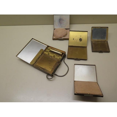 320 - Four mother of pearl compacts and a cigarette case compact
