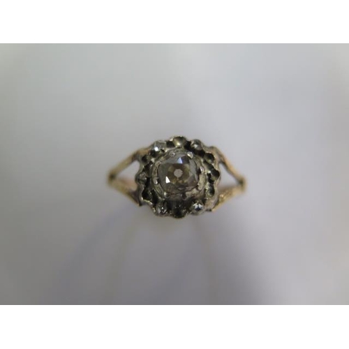 644 - A yellow gold diamond cluster ring, missing 8 small diamonds, some wear to shank, ring size N, appro... 