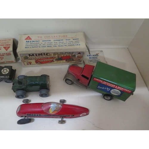 907 - Six tinplate Minic clockwork vehicles and a plastic Minic Morris Saloon, five with part boxes, some ... 