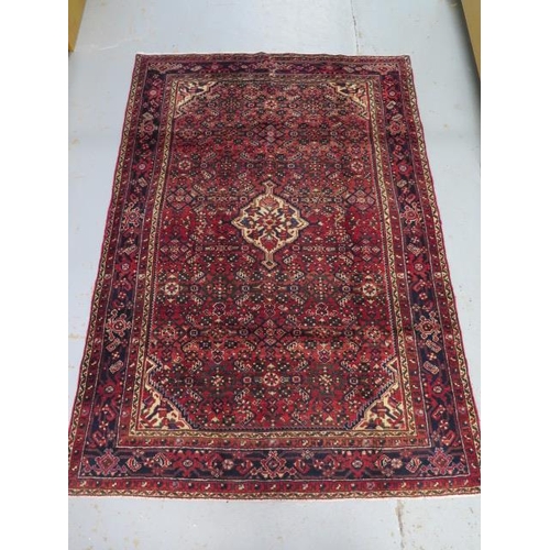 203 - A hand knotted woollen Hamadam rug, 2.00m x 1.47m