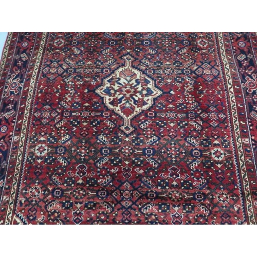 203 - A hand knotted woollen Hamadam rug, 2.00m x 1.47m