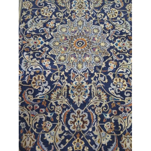 207 - A hand knotted woollen Kashan rug, 2.20m x 1.32m