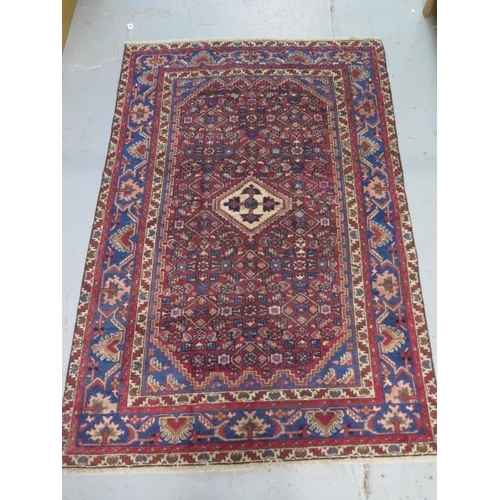 209 - A hand knotted woollen Hamadam rug, 2.00m x 1.35m