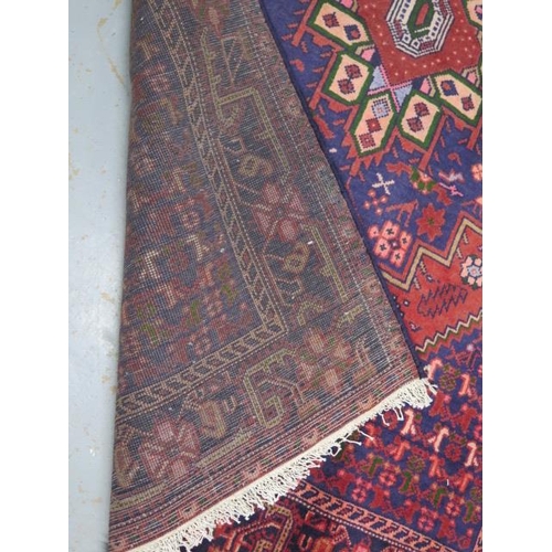 211 - A hand knotted woollen Hamadam rug, 2.00m x 1.20m