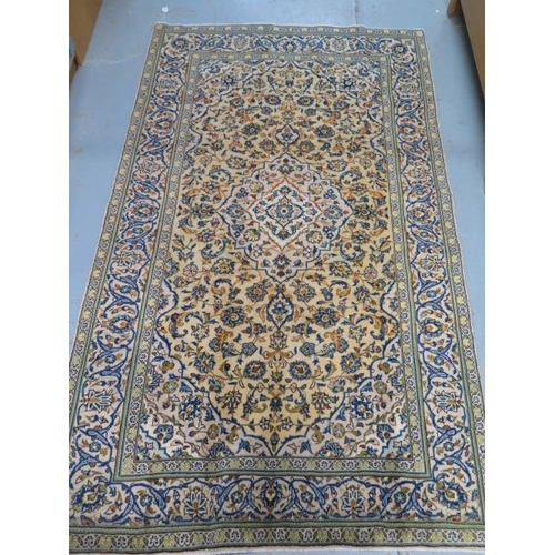 213 - A hand knotted woollen Kashan rug, 2.44m x 1.45m