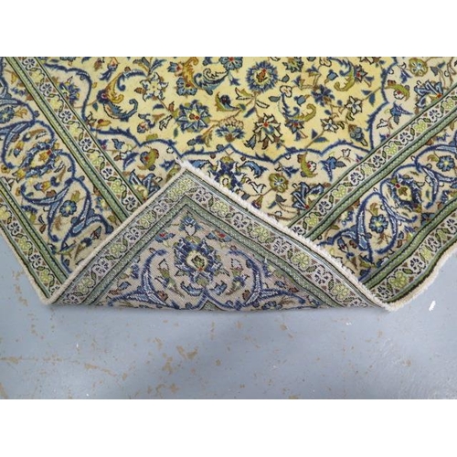 213 - A hand knotted woollen Kashan rug, 2.44m x 1.45m