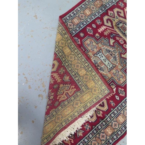 224 - A hand knotted woollen fine Mori Jaldar rug, 123cm x 80cm