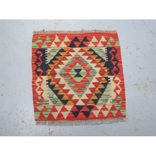 227 - A hand knotted woollen Chobi Kilim rug, 49cm x 50cm