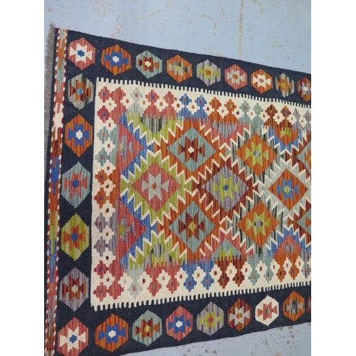 229 - A hand knotted woollen Chobi Kilim rug, 156cm x 100cm