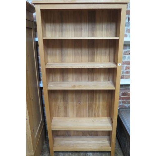 29 - A modern oak bookcase with adjustable shelves, made by a local craftsman to a high standard, 202cm t... 