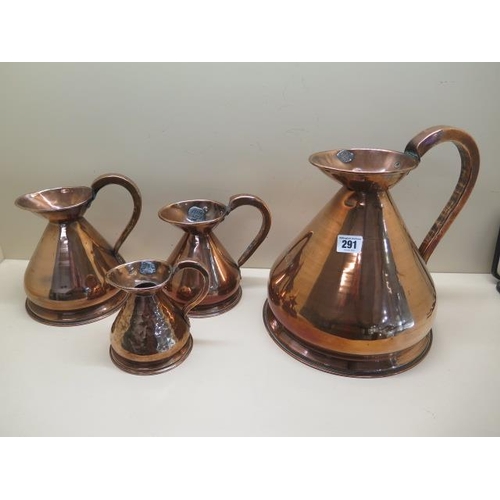 291 - Four copper measuring jugs from 1/2 pint to 1 gallon, multiple dents to 1/2 pint others generally go... 