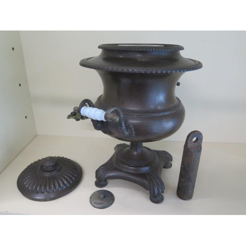 293 - A bronze Victorian samovar with cast iron heat weight, 43cm tall