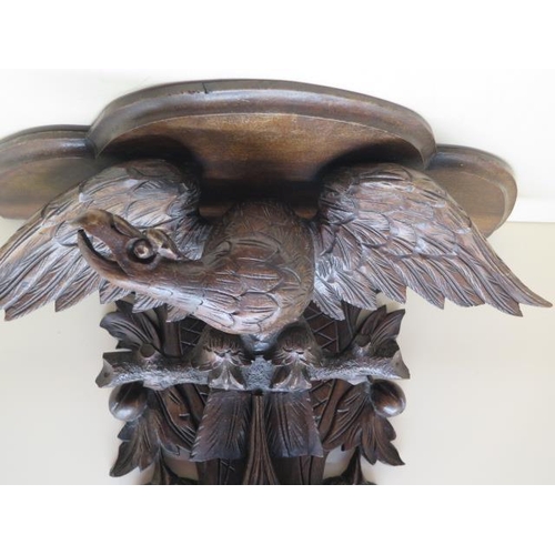 67 - A carved wood Eagle fruit and berry clock bracket, 61cm tall x 56cm x 23cm deep, in generally good c... 