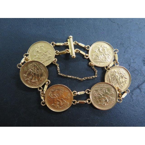 851 - A gold bracelet set with six George V half sovereigns, dated 1914, 1913 x 2, 1912 x 2 and 1926, brac... 