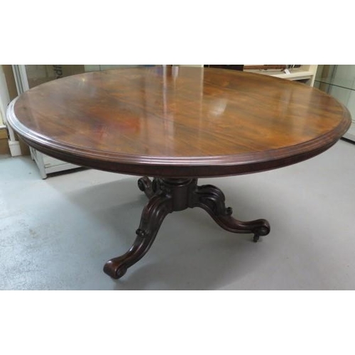 69 - A 19th century rosewood tilt top breakfast table of circular form on central bulbous stem and three ... 