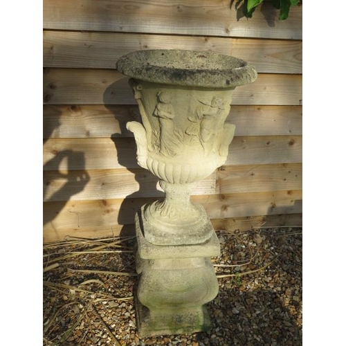 12 - A classical stone effect garden urn on stand, 95cm tall x 40cm diameter