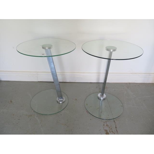 17 - A pair of glass and chrome side tables 54cm tall x 43cm diameter