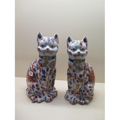 23 - A pair of modern Imari style smiling cats, 35cm tall, both good