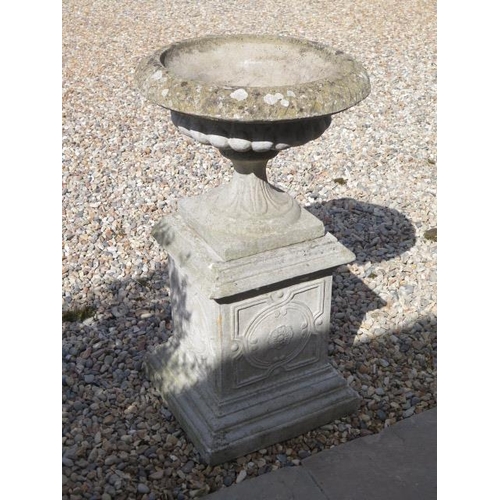 25 - A stone effect garden urn on stand, 90cm tall x 51cm diameter (comes in three parts)