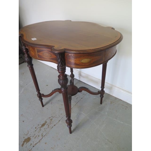 58 - An Edwardian inlaid side table with a shaped top on carved reeded legs united by an undertier, 72cm ... 