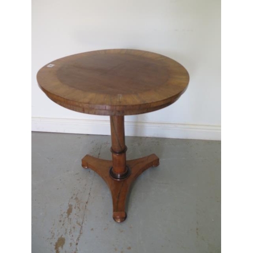 59 - A Victorian rosewood tilt top side table on a turned column and tripartite platform base, 61cm diame... 