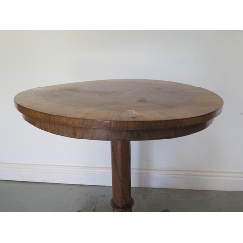 59 - A Victorian rosewood tilt top side table on a turned column and tripartite platform base, 61cm diame... 