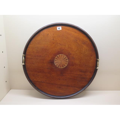 62 - A 19th century mahogany round tray, 57cm, with inlay