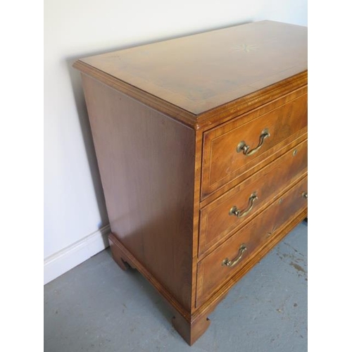 66 - A reveneered 3 drawer chest with star inlay, standing on shaped bracket feet, 90cm tall x 95cm x 50c... 