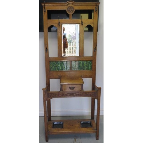 70 - An oak mirror and tile back hallstand with glove drawer, 192cm tall x 80cm