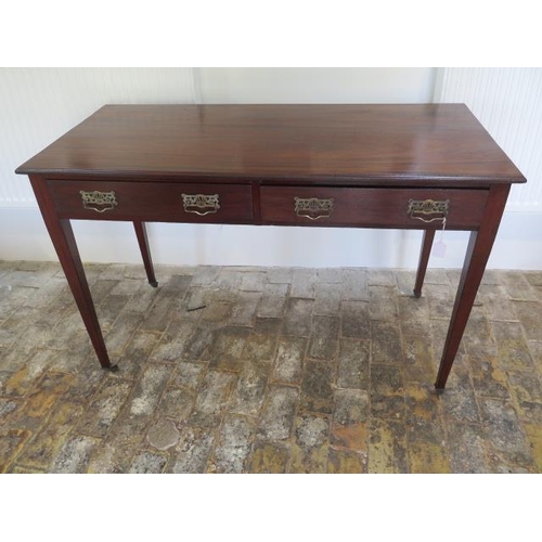 74 - A circa 1900's mahogany Heals and Son side table with 2 frieze drawers tapering legs, caps and casto... 
