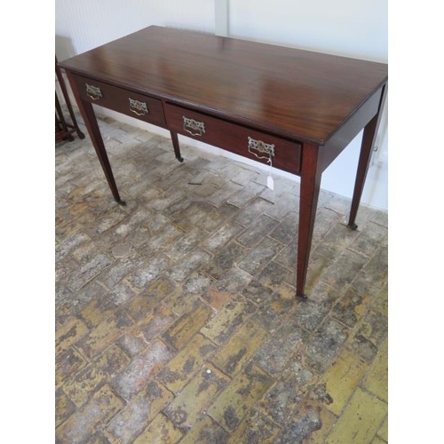 74 - A circa 1900's mahogany Heals and Son side table with 2 frieze drawers tapering legs, caps and casto... 