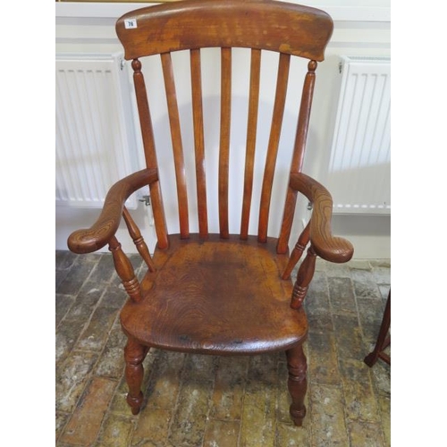 78 - A 19th century elm and beech broad arm and splat back armchair, in polished condition