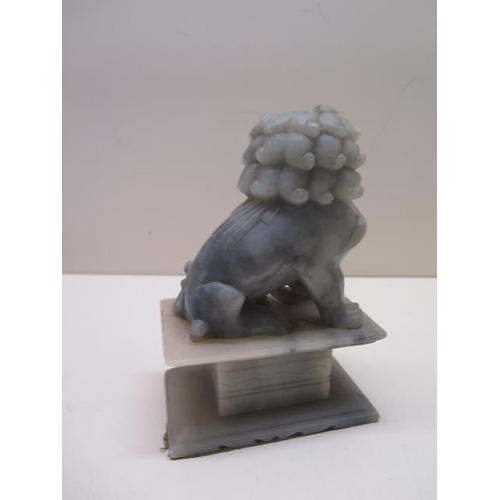 309 - Two soapstone dogs of Fo, 19cm and 16cm tall, very minor chips but generally good