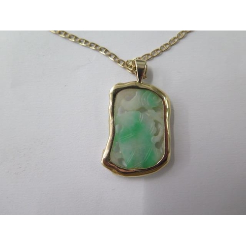 480 - A gilt metal mounted jade pendant on a 14ct yellow gold chain, 48cm long, total weight approx 9 gram... 