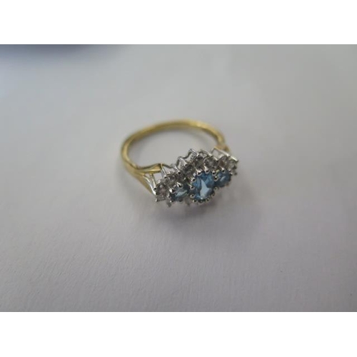 486 - A 9ct yellow gold blue topaz and CZ dress ring, size M, approx 2.4 grams, in good condition