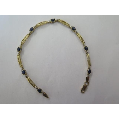 489 - A 10ct yellow gold sapphire bracelet, 18cm long, approx 3.4 grams, in good condition