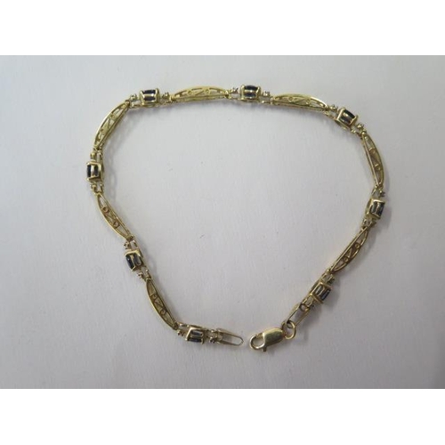 489 - A 10ct yellow gold sapphire bracelet, 18cm long, approx 3.4 grams, in good condition