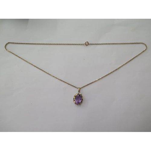 492 - A gilt metal amethyst pendant on a 9ct gold 50cm chain, total weight approx 7.5 grams, in good condi... 