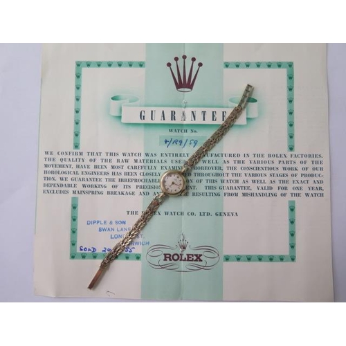 646 - A 9ct yellow gold ladies 1955 Rolex manual wind bracelet wristwatch with original guarantee, 18mm ca... 