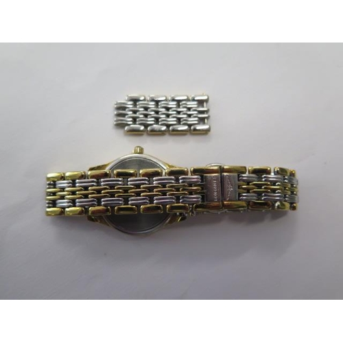 648 - A ladies Longines bi-colour quartz bracelet wristwatch with date, 24mm case, with spare links and bo... 