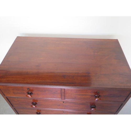 76 - An early 19th century mahogany and oak lined 2 over 3 chest of drawers on turned feet, in good resto... 