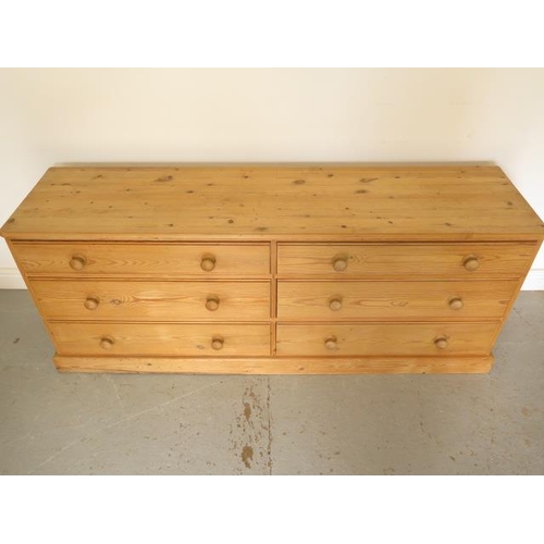 12 - A pine 6 drawer long chest, 69cm tall x 173cm x 44cm, in good condition