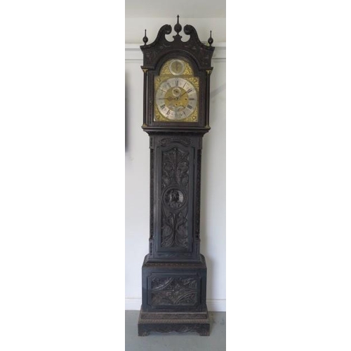 150 - An impressive carved oak 8 day three train longcase clock, quarter chiming on eight bells and striki... 