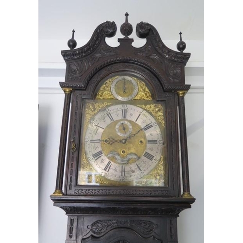 150 - An impressive carved oak 8 day three train longcase clock, quarter chiming on eight bells and striki... 