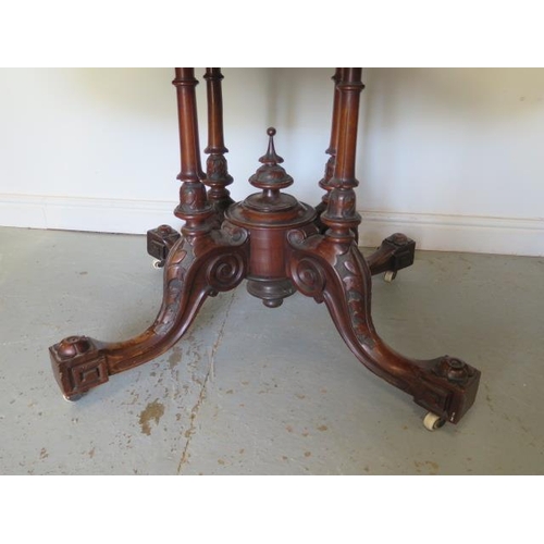 60 - A good Victorian burr walnut tilt top oval breakfast table on a carved quatrefoil column base, 74cm ... 