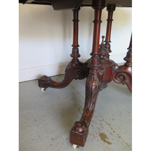 60 - A good Victorian burr walnut tilt top oval breakfast table on a carved quatrefoil column base, 74cm ... 