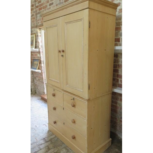 64 - A 19th century stripped pine linen press / cupboard on chest with a 2 door top enclosing two shelves... 